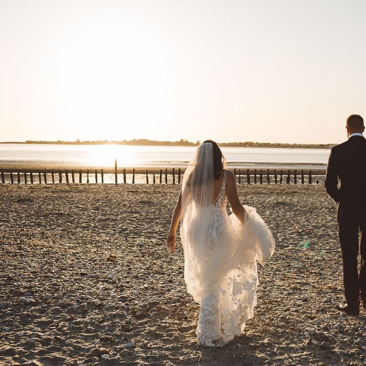 Bride and groom enjoy a beach shoot together at golden hour