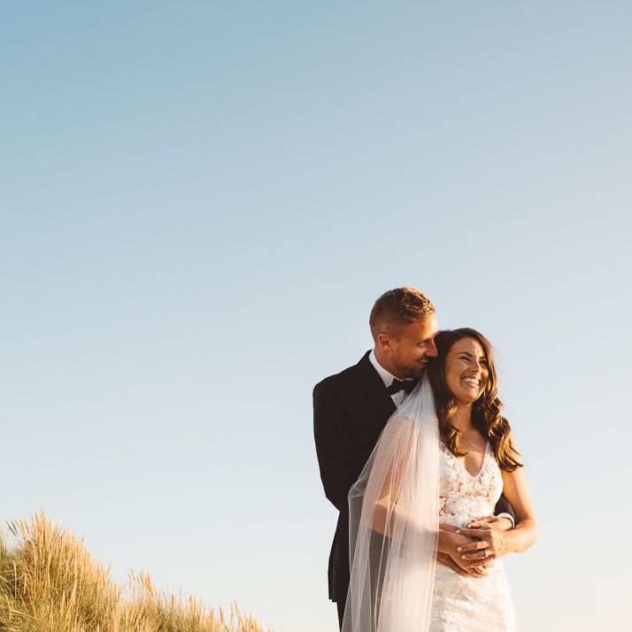 Couple embrace at romantic and intimate wedding