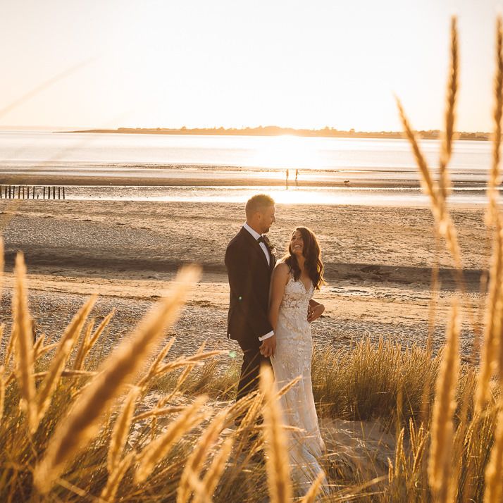 Couple embrace at Crouchers Orchards for romantic and intimate wedding