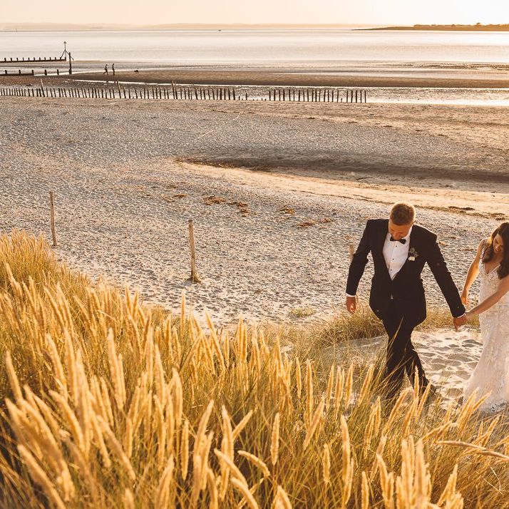 Couple embrace at Crouchers Orchards for romantic and intimate wedding