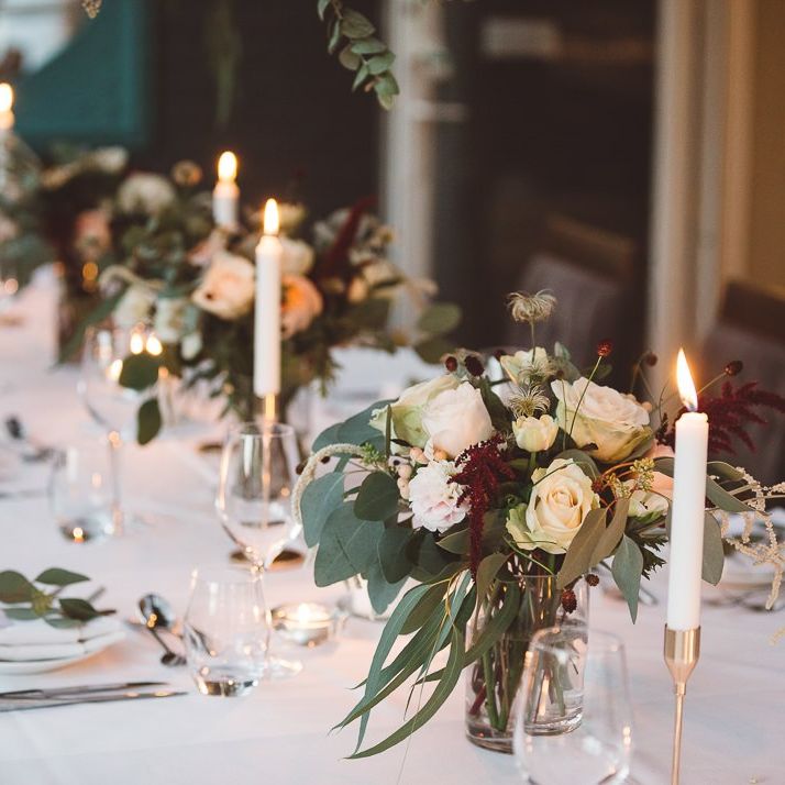 Beautiful hanging foliage styled with eucalyptus and gold candlesticks for a romantic and intimate dinner