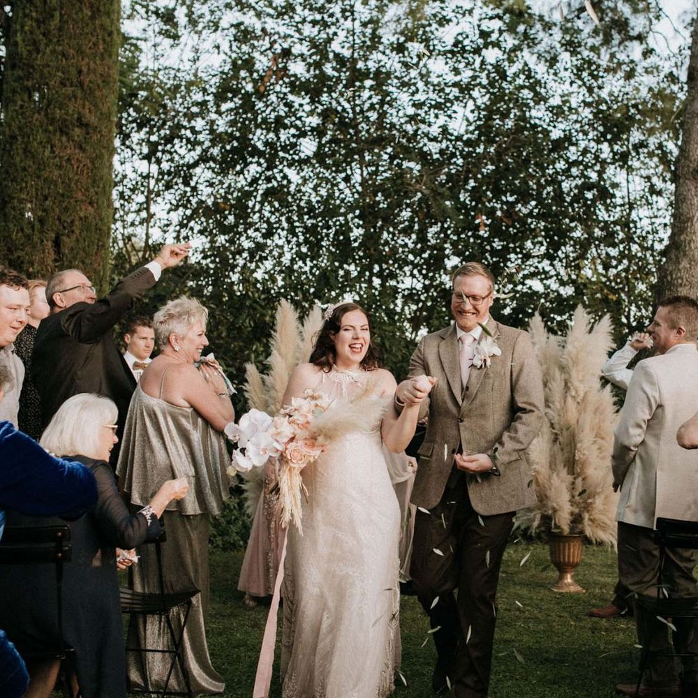 Confetti exit at outdoor ceremony for bride and groom