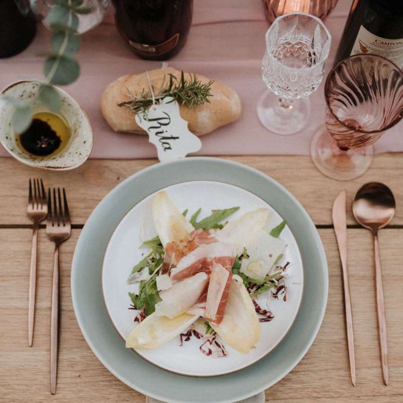 Delicious wedding breakfast with brass cutlery