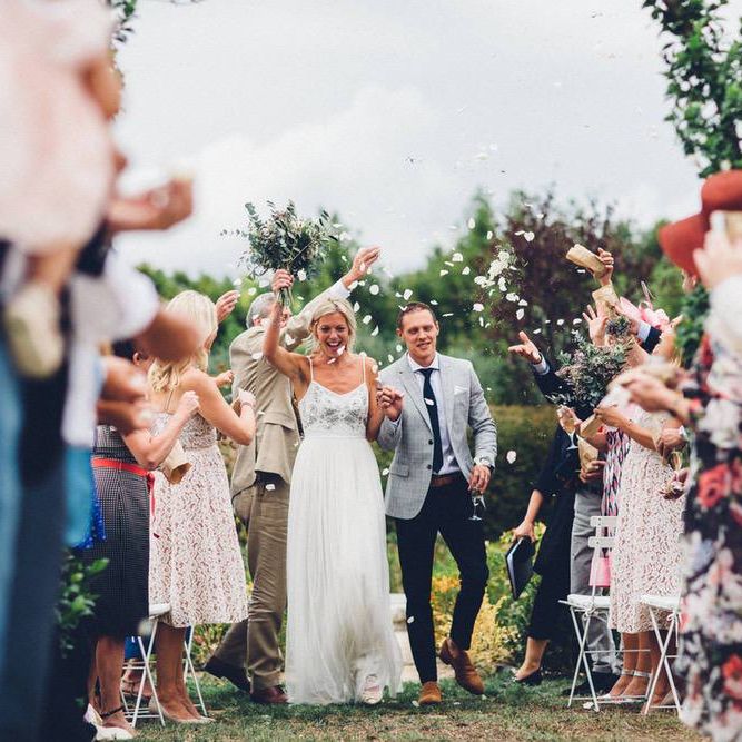 Confetti Moment | Bride in Needle &amp; Thread Gown | Groom in Reiss Chinos &amp; Blazer | Outdoor Destination Wedding at Le Peit Hameau Wedding Venue Provence, South of France Planned by By Mademoiselle | Lovestruck Photography
