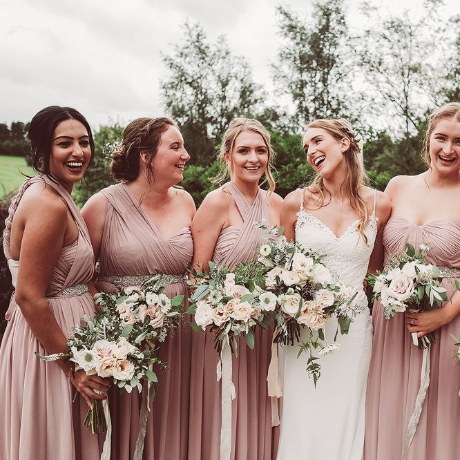 Bridesmaids In Pale Pink // Brookfield Barn Wedding Venue With Rustic Styling And Bride In Enzoani With Images From Lemonade Pictures And Film By Kitebox Films