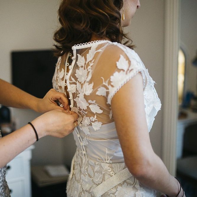 Bride wearing Phase Eight Wedding Dress with her bridesmaid in embellished dress
