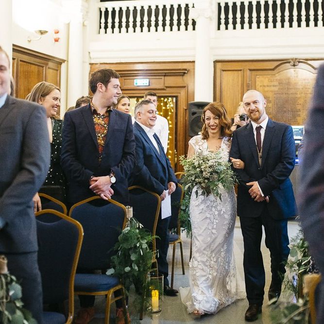 Bride wearing Phase Eight Wedding Dress walking down the aisle at London ceremony