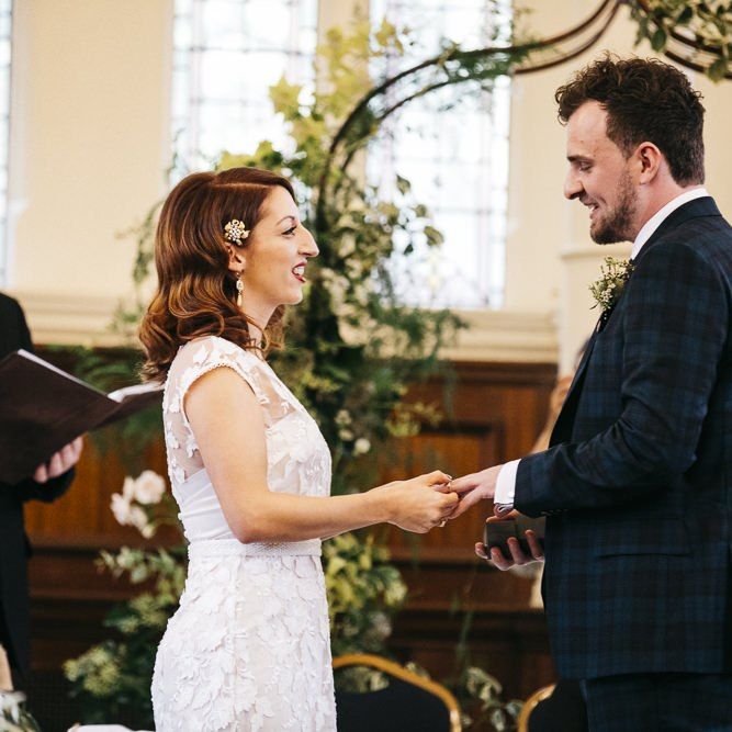 Bride wearing Phase Eight Wedding Dress at  London ceremony with foliage decor