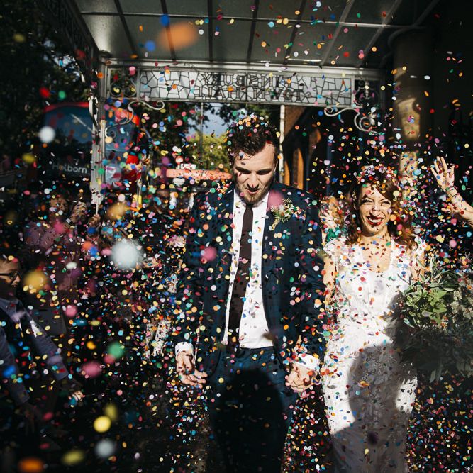 Bride and groom confetti shot at autumn celebration in London