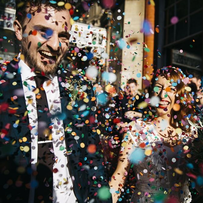 Bride and groom confetti shot at autumn celebration in London