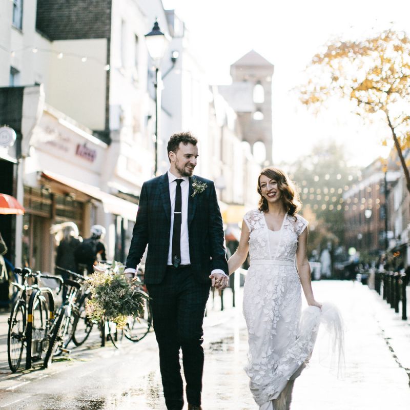Bride and groom steal a moment wearing Phase Eight Wedding Dress
