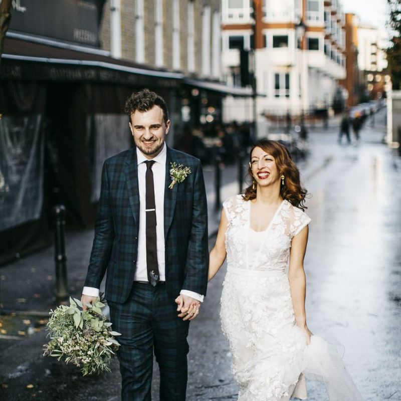 Bride and groom steal a moment wearing Phase Eight Wedding Dress