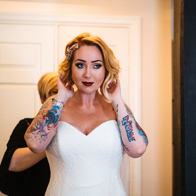 Wedding Morning Preparations | Bride in Strapless Sassi Holford Wedding Dress with Sweetheart Neckline | Edison Bulb Floral Installation at Kingsthorpe Lodge Barn Wedding | Johnny Dent Photography