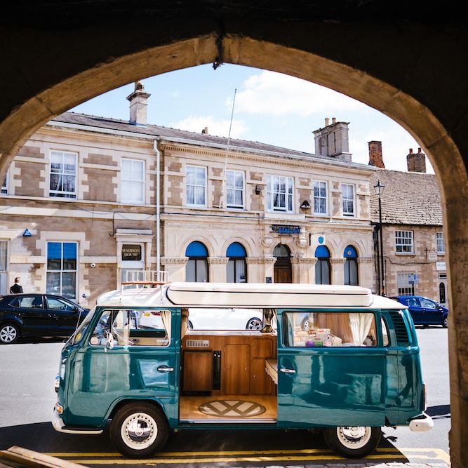 Wedding Transport | Turquoise Camper Van | Edison Bulb Floral Installation at Kingsthorpe Lodge Barn Wedding | Johnny Dent Photography
