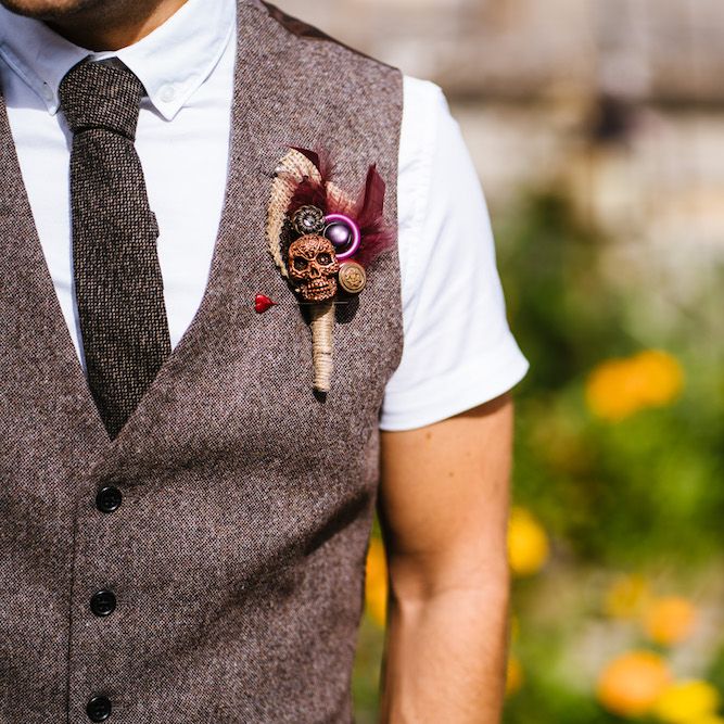 Tweed Waistcoat with Skull &amp; Feather Buttonhole | Edison Bulb Floral Installation at Kingsthorpe Lodge Barn Wedding | Johnny Dent Photography