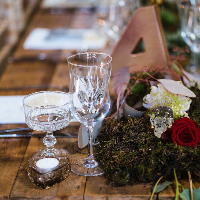 Wedding Reception Decor | Banquet Tables | Moss Garlands | Glass Skulls | Edison Bulb Floral Installation at Kingsthorpe Lodge Barn Wedding | Johnny Dent Photography