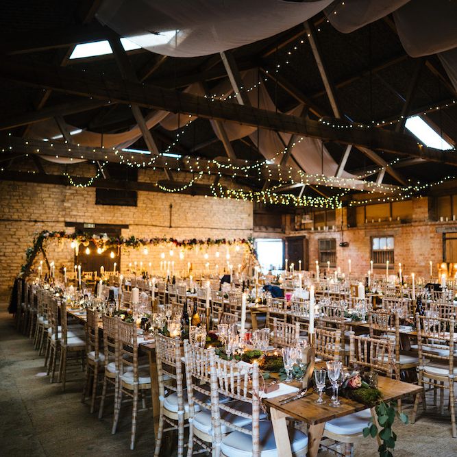 Wedding Reception Decor | Banquet Tables | Festoon Lights | Edison Bulb Floral Installation at Kingsthorpe Lodge Barn Wedding | Johnny Dent Photography