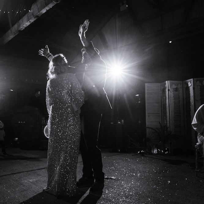 First Dance | Bride in Sequinned Kimono from ASOS | Groom in Burgundy Tweed Three Piece Suit | Edison Bulb Floral Installation at Kingsthorpe Lodge Barn Wedding | Johnny Dent Photography