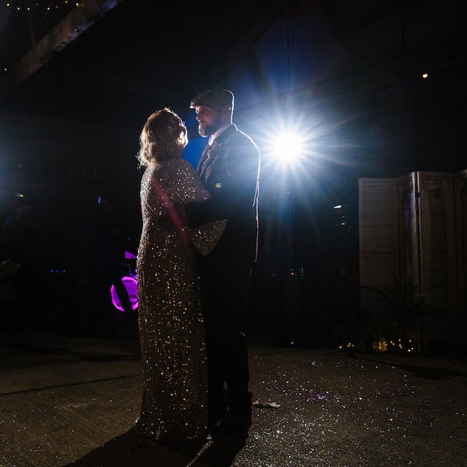 First Dance | Bride in Sequinned Kimono from ASOS | Groom in Burgundy Tweed Three Piece Suit | Edison Bulb Floral Installation at Kingsthorpe Lodge Barn Wedding | Johnny Dent Photography