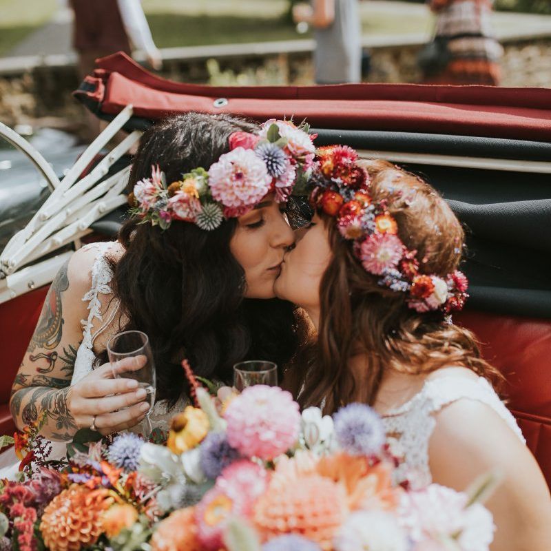 Lesbian wedding with dahlia flower crowns