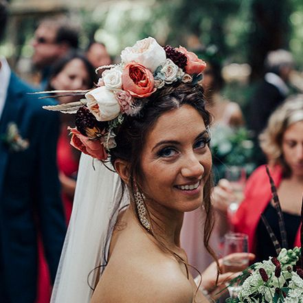 Boho bride with pink and red flower headdress