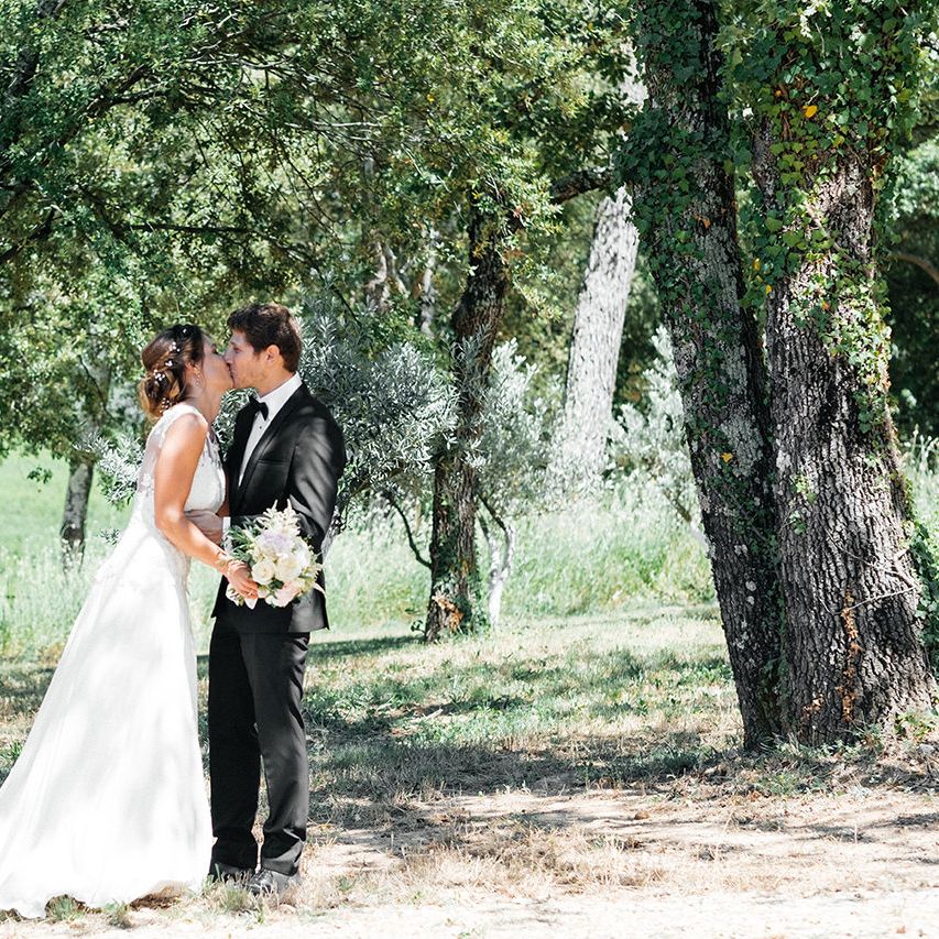 First Look | Elegant Bride in Lace Wedding Dress | Groom in Black Tie Suit | Outdoor Wedding at Commanderie de Peyrassol, Provence, France Styled by La Chuchoteuse | Lace Bridal Gown | Black Tie Suit | Rustic Stretch Tent Reception | Raisa Zwart Photography
