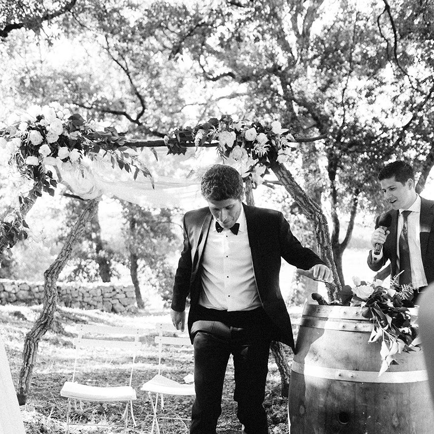 Wedding Ceremony | Groom in Black Tie Suit | Outdoor Wedding at Commanderie de Peyrassol, Provence, France Styled by La Chuchoteuse | Lace Bridal Gown | Black Tie Suit | Rustic Stretch Tent Reception | Raisa Zwart Photography