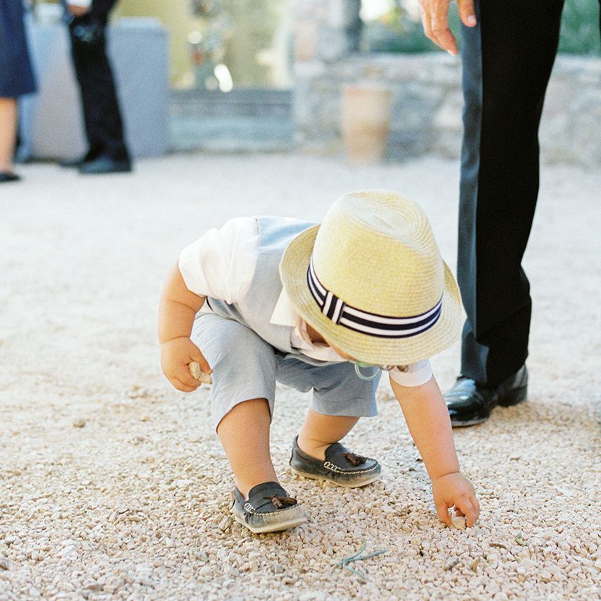 Page Boy in Shorts and Trilby | Outdoor Wedding at Commanderie de Peyrassol, Provence, France Styled by La Chuchoteuse | Lace Bridal Gown | Black Tie Suit | Rustic Stretch Tent Reception | Raisa Zwart Photography