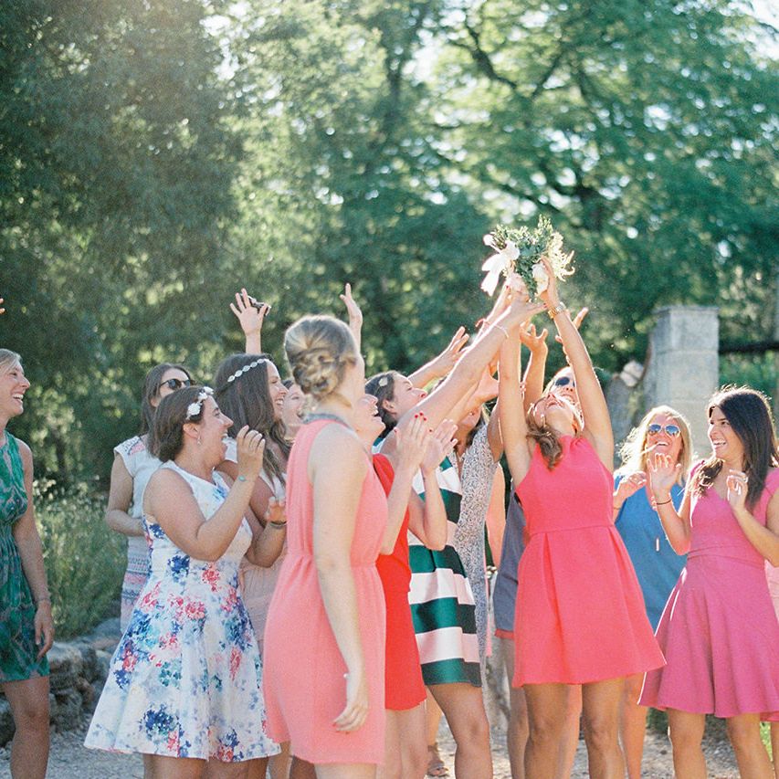 Throwing The Bouquet | Outdoor Wedding at Commanderie de Peyrassol, Provence, France Styled by La Chuchoteuse | Lace Bridal Gown | Black Tie Suit | Rustic Stretch Tent Reception | Raisa Zwart Photography