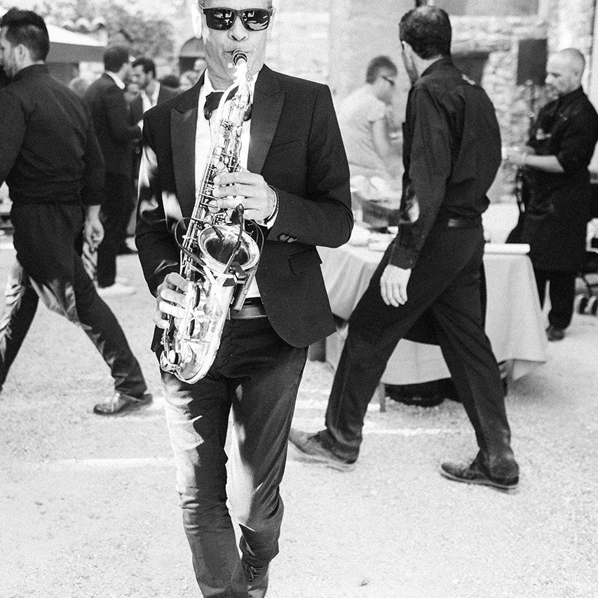 Saxophonist | Outdoor Wedding at Commanderie de Peyrassol, Provence, France Styled by La Chuchoteuse | Lace Bridal Gown | Black Tie Suit | Rustic Stretch Tent Reception | Raisa Zwart Photography