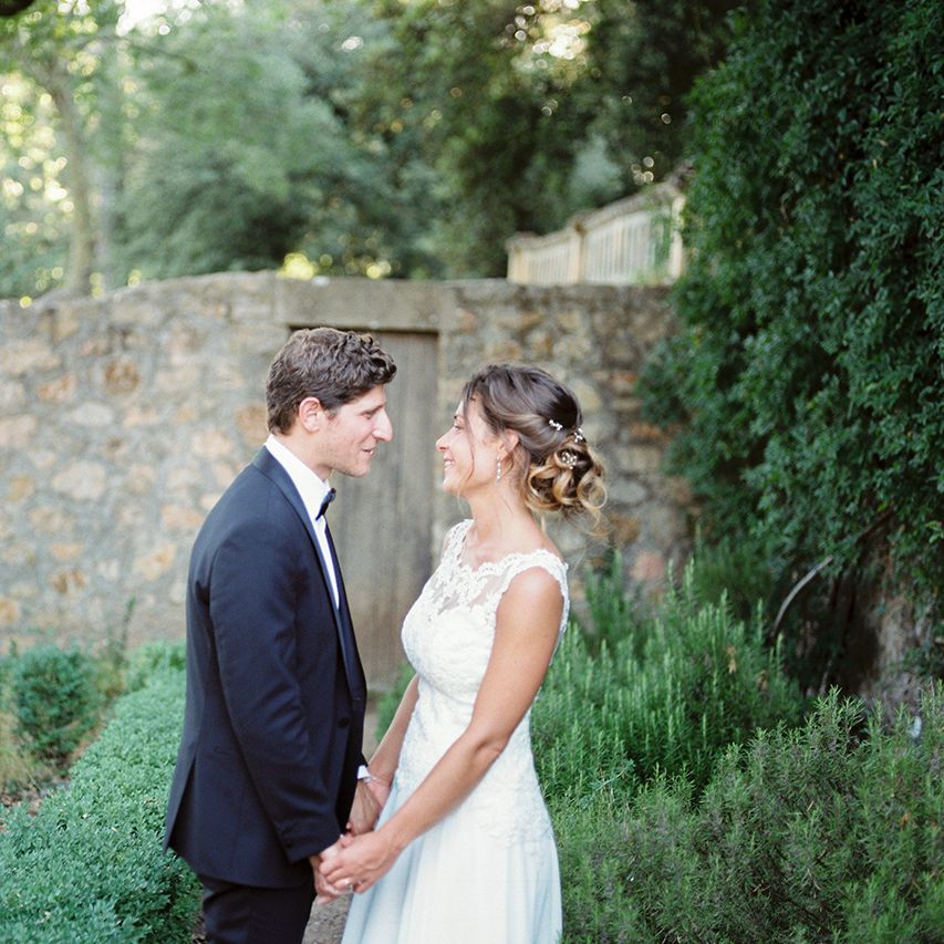 Elegant Bride in Lace Wedding Dress | Groom in Black Tie Suit | Outdoor Wedding at Commanderie de Peyrassol, Provence, France Styled by La Chuchoteuse | Lace Bridal Gown | Black Tie Suit | Rustic Stretch Tent Reception | Raisa Zwart Photography