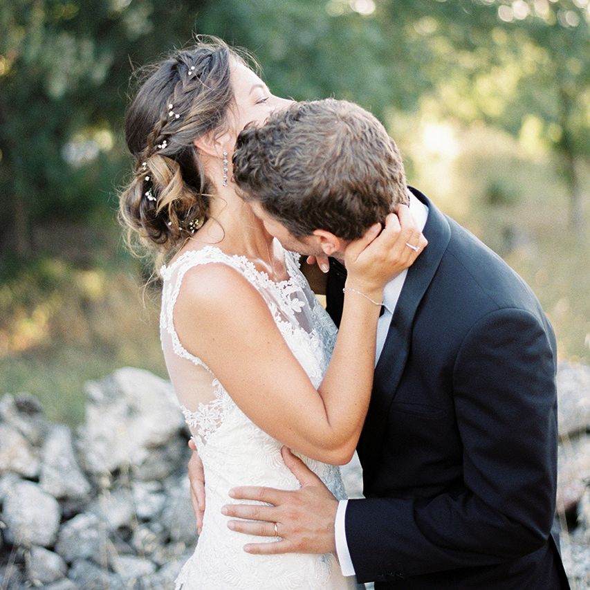 Elegant Bride in Lace Wedding Dress | Groom in Black Tie Suit | Outdoor Wedding at Commanderie de Peyrassol, Provence, France Styled by La Chuchoteuse | Lace Bridal Gown | Black Tie Suit | Rustic Stretch Tent Reception | Raisa Zwart Photography