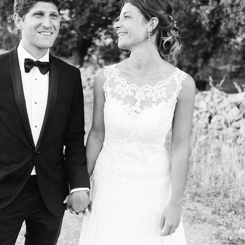 Elegant Bride in Lace Wedding Dress | Groom in Black Tie Suit | Outdoor Wedding at Commanderie de Peyrassol, Provence, France Styled by La Chuchoteuse | Lace Bridal Gown | Black Tie Suit | Rustic Stretch Tent Reception | Raisa Zwart Photography