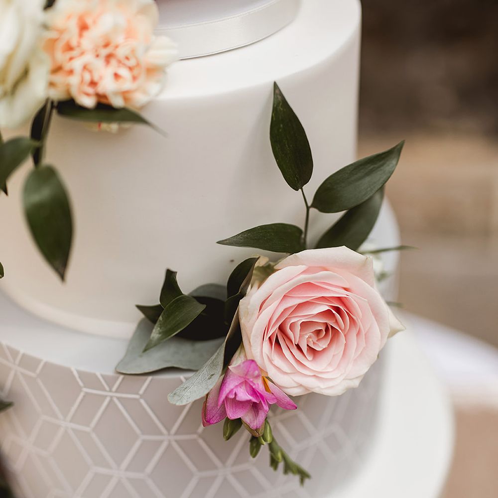 Iced Wedding Cake With Geometric Details // Geometric Details &amp; Hanging Foliage For Hengrave Hall Wedding With Outdoor Reception With Images From Sam And Louise Photography