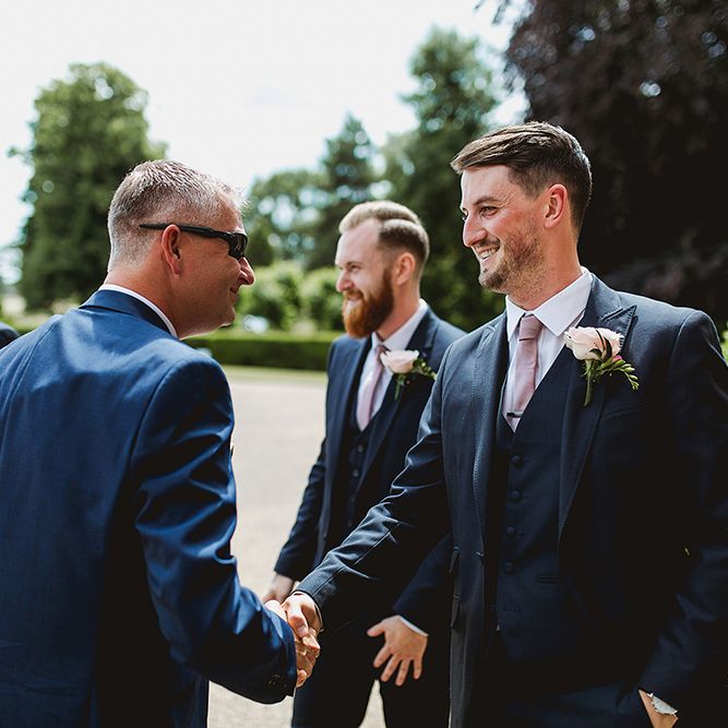 Groom &amp; Groomsmen In Navy Blue Suits // Geometric Details &amp; Hanging Foliage For Hengrave Hall Wedding With Outdoor Reception With Images From Sam And Louise Photography
