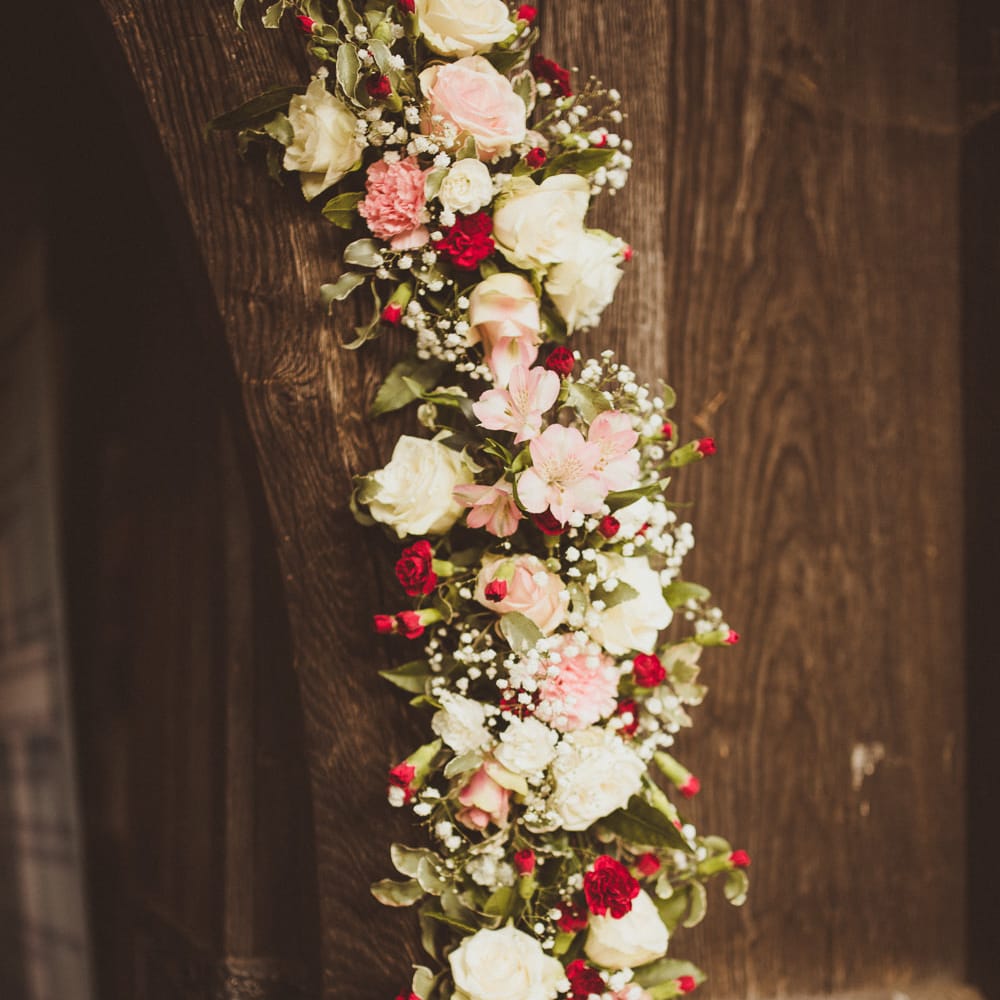 Church Burgundy, Pink &amp; White Floral Arch Flowers | Burgundy &amp; Gold Winter Wedding at Ramster Hall Weddings, Surrey | Matt Penberthy Photography | John Harris Wedding Films