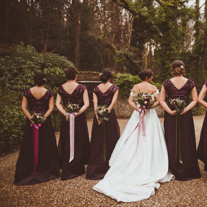 Bridesmaids in Coast Burgundy Separates | Bride in Lillian West Bridal Separates | Burgundy &amp; Gold Winter Wedding at Ramster Hall Weddings, Surrey | Matt Penberthy Photography | John Harris Wedding Films