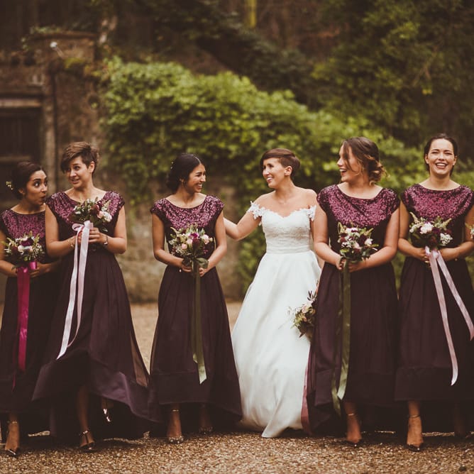 Bridesmaids in Coast Burgundy Separates | Sequin Tops &amp; High Low Skirts | Bride in Lillian West Bridal Separates | Burgundy &amp; Gold Winter Wedding at Ramster Hall Weddings, Surrey | Matt Penberthy Photography | John Harris Wedding Films