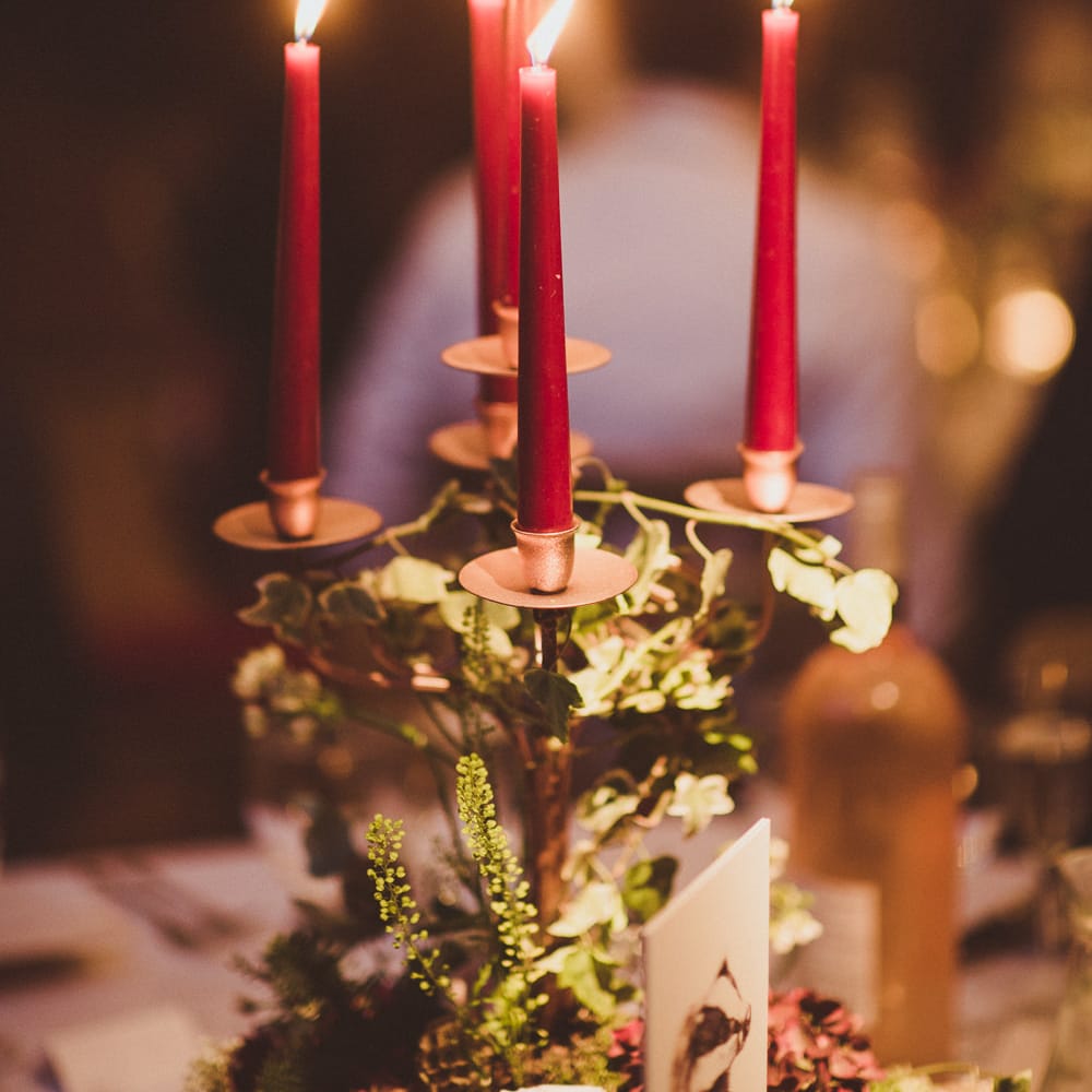 Candelabra with Tapper Candles | Burgundy &amp; Gold Winter Wedding at Ramster Hall Weddings, Surrey | Matt Penberthy Photography | John Harris Wedding Films
