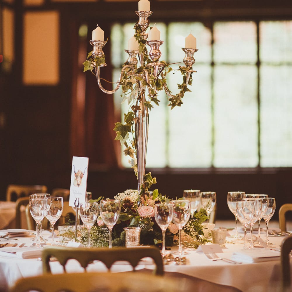 Candelabra Centrepiece | Burgundy &amp; Gold Winter Wedding at Ramster Hall Weddings, Surrey | Matt Penberthy Photography | John Harris Wedding Films