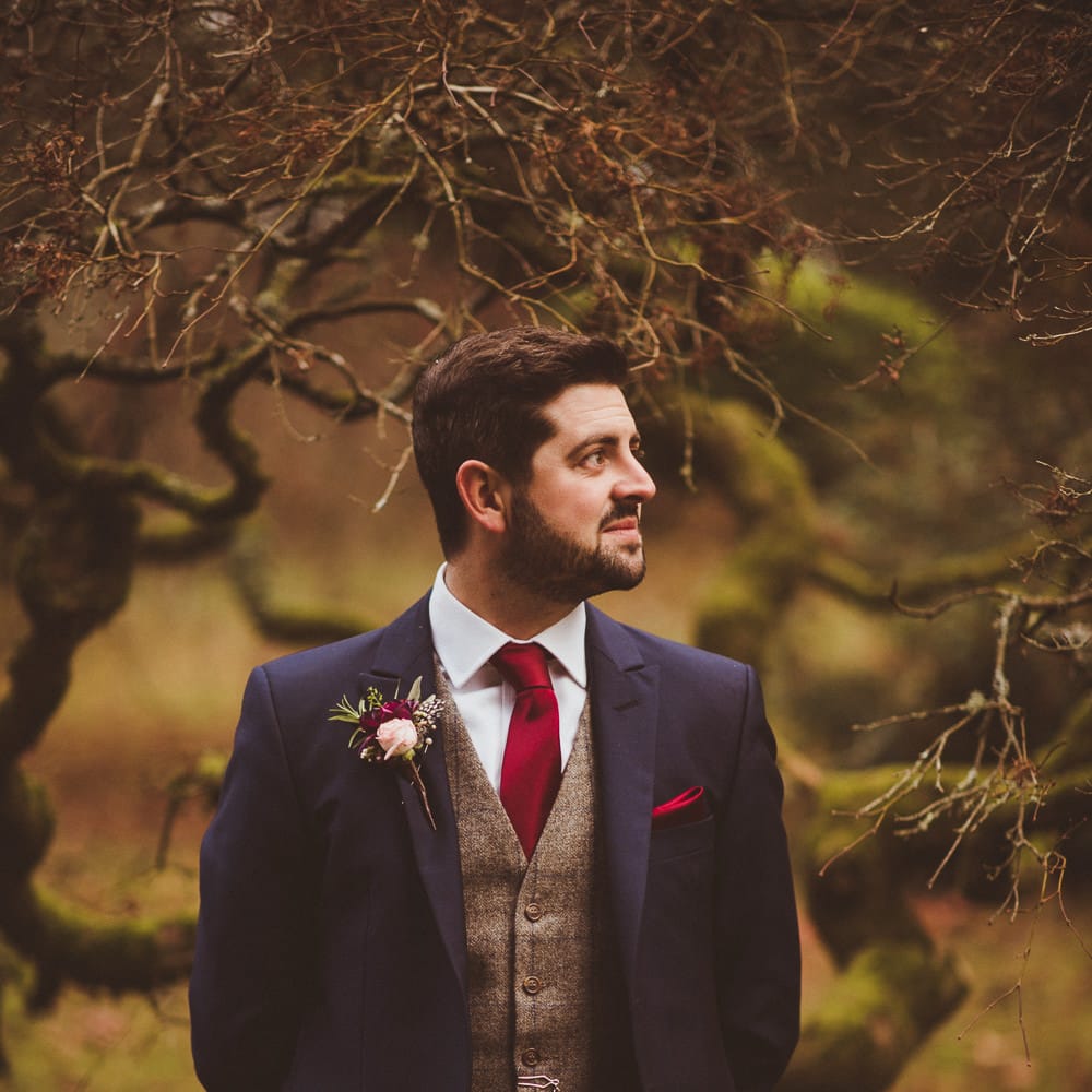 Groom in Navy Suit &amp; Tweed Waistcoat | Burgundy &amp; Gold Winter Wedding at Ramster Hall Weddings, Surrey | Matt Penberthy Photography | John Harris Wedding Films