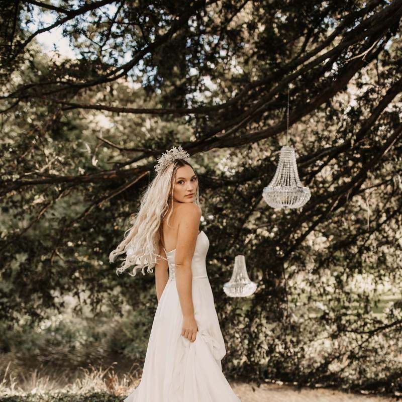 Bride in strapless wedding dress with jewelled crown