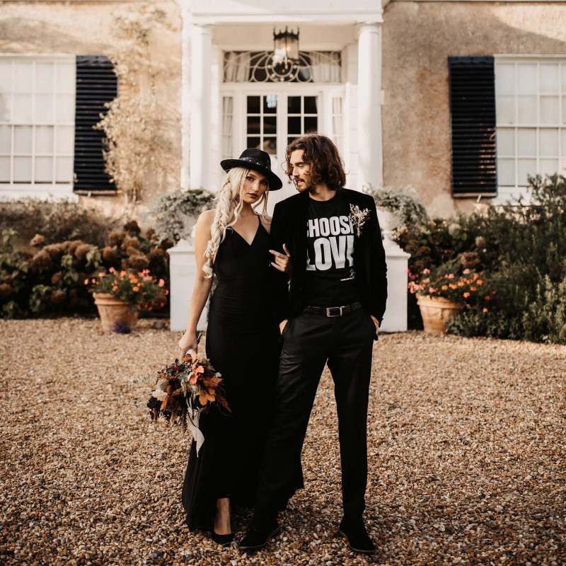 Stylish bride and groom outside Preston court for Halloween wedding  shoot