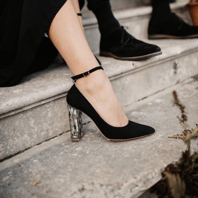 Black ankle strap shoes with tortoise shell heels