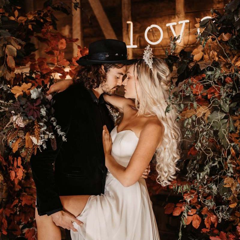 Intimate bride and groom portrait for Halloween wedding at Preston Court with Autumn flowers