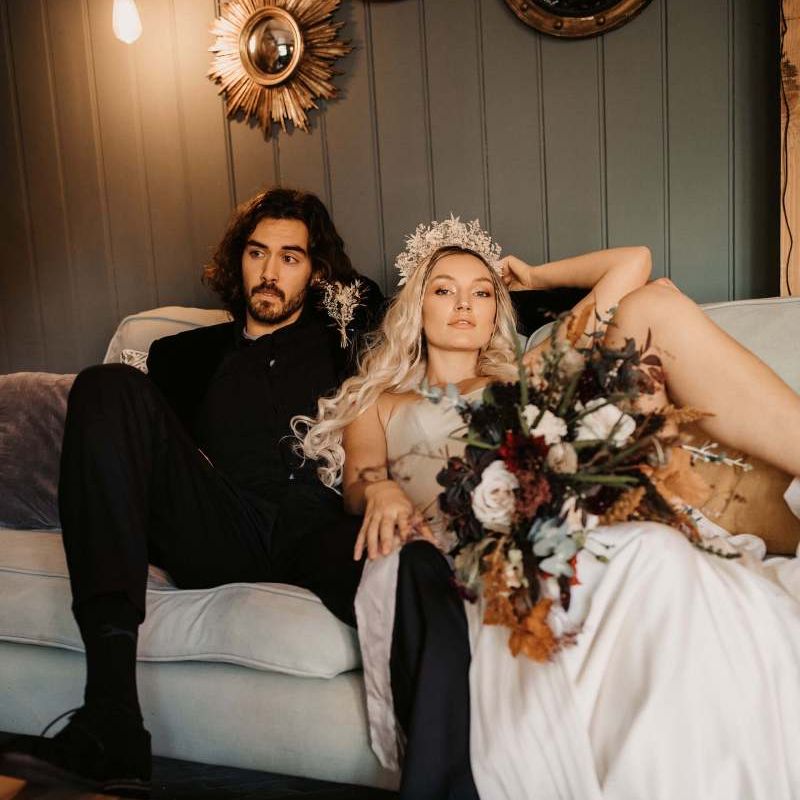 Bride and groom relaxing at Preston Court Halloween wedding