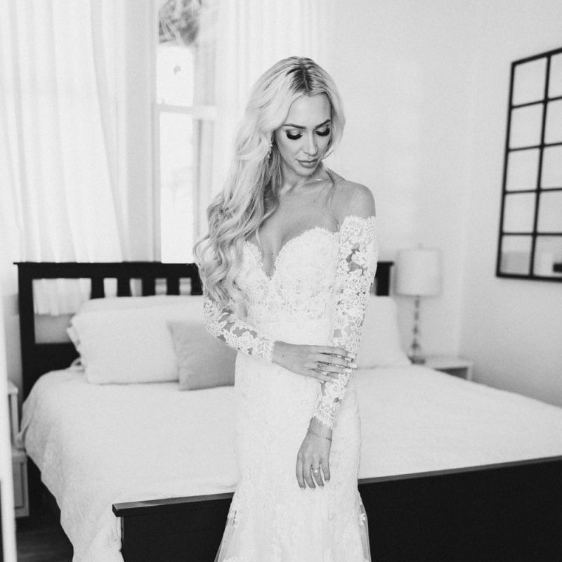 Bride on wedding morning in lace Pronovias wedding dress