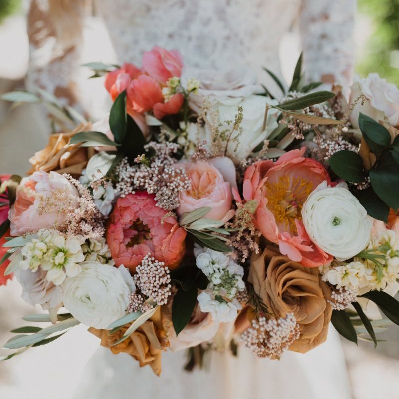 Coral peony, peach roses and white ranunculus  floral bouquet