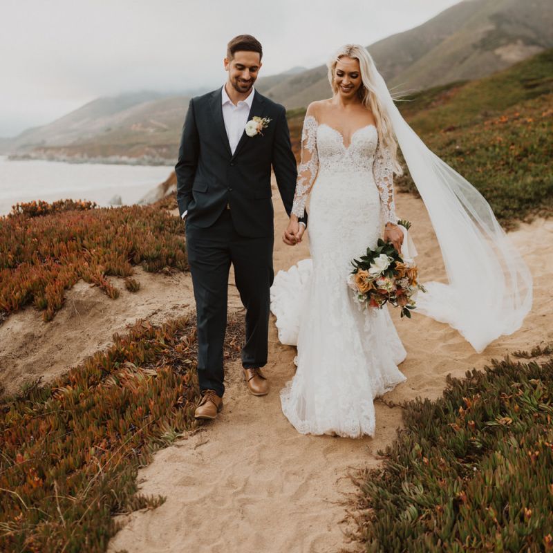 Bride and groom walking hand in hand at California elopement