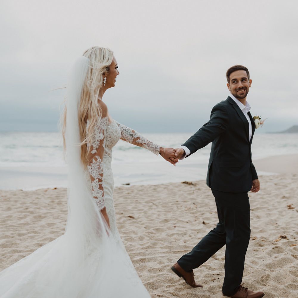 Bride and groom beach portrait by Ariele Chapman Photography